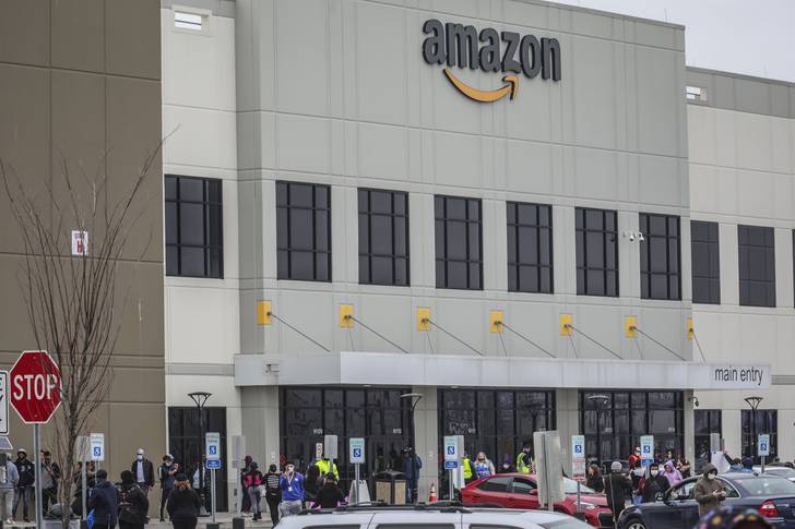 Workers at a walkout at Amazon's Staten Island facility.
